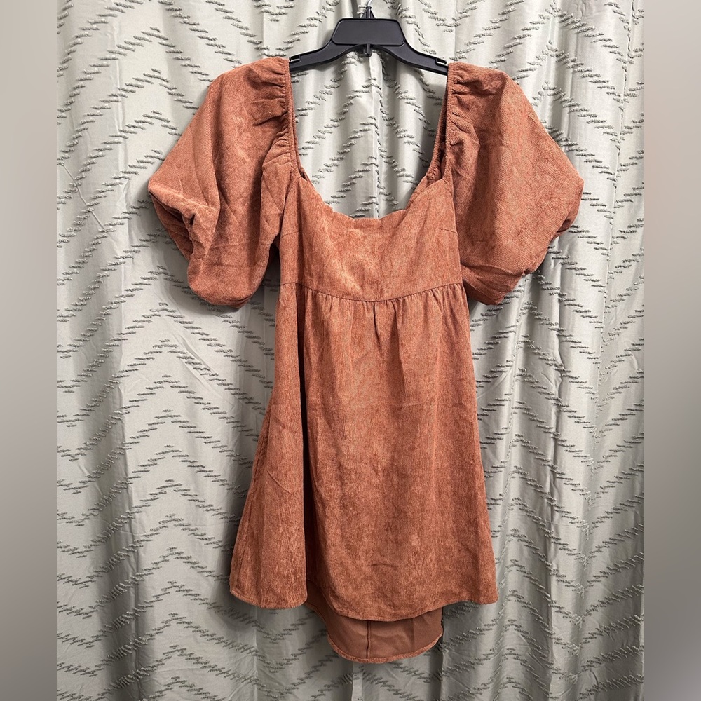 Blue rain mini dress size L 
bought from Francesca’s. 
Ties in the open